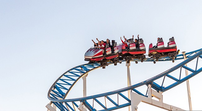 people on a rollercoaster